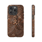 Woman holding Paa Guardian Tough iPhone Case - Hawaiian Copper Carved Tiki Polynesian Design - The Local Banyan