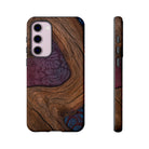 Woman holding Rooted Tough Samsung Galaxy Case - Hawaiian Koa Wood Island Strength Tribal Design - The Local Banyan